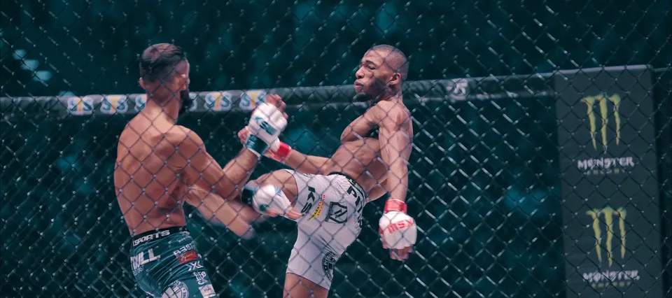 Fighters in the cage during a KSW event